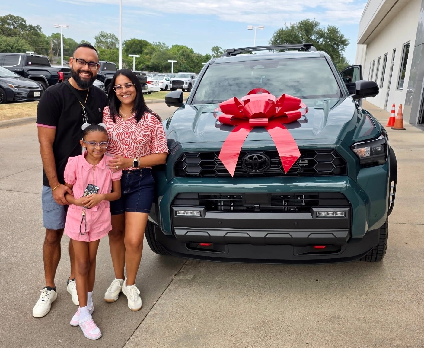 Family with their new Toyota at Freeman Toyota Hurst TX